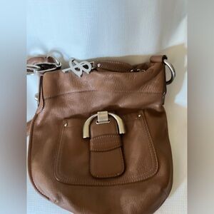 B. Makowsky cross body bag 10 inches wide 12.5 inches long.